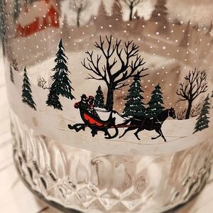 Festive Glass Jar with Red Lid and Snowy Scene
